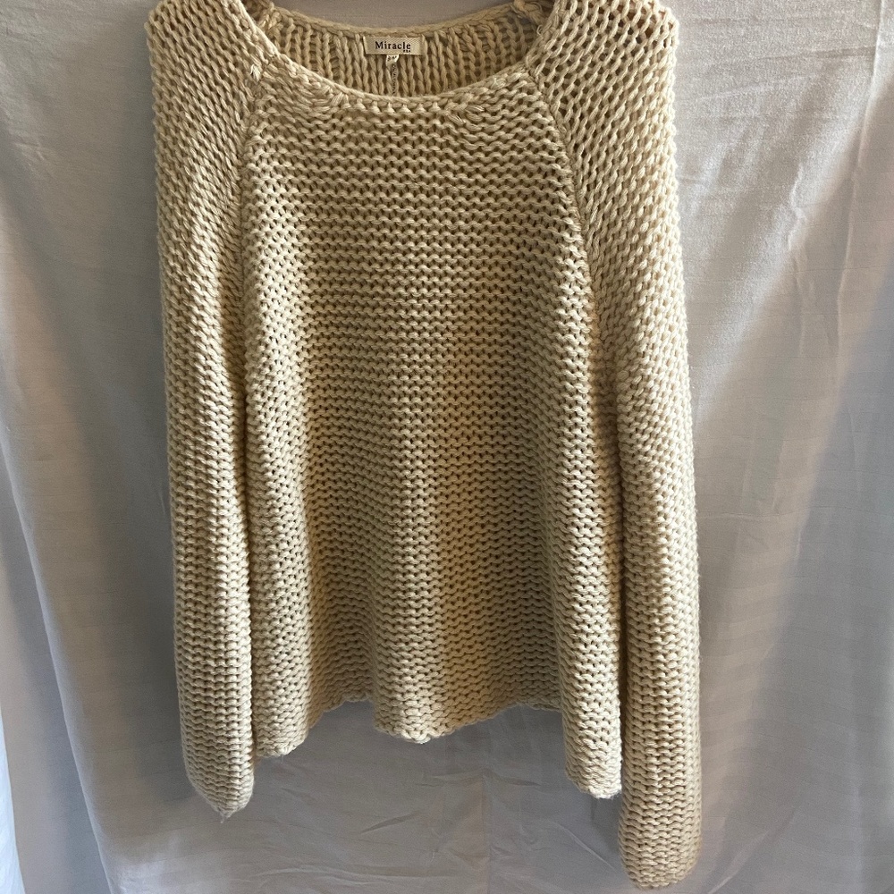 Off-white oversized sweater.